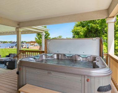 above ground hot tub sitting on porch